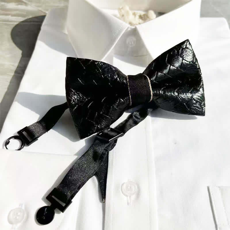Papillon in pelle nera con motivo intrecciato da uomo