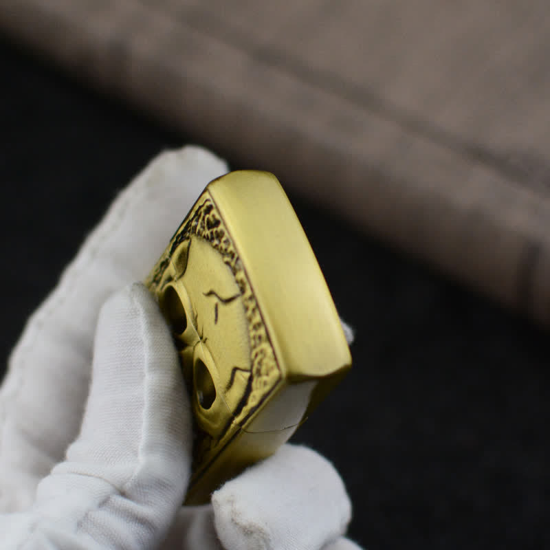 Accendino a butano ricaricabile con design a forma di grande teschio