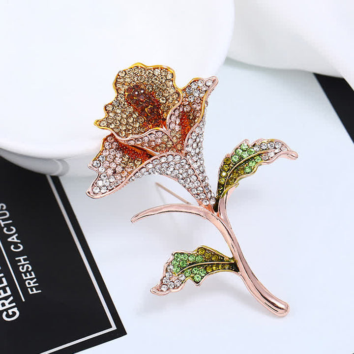 Graziosa spilla con fiore di orchidea e strass