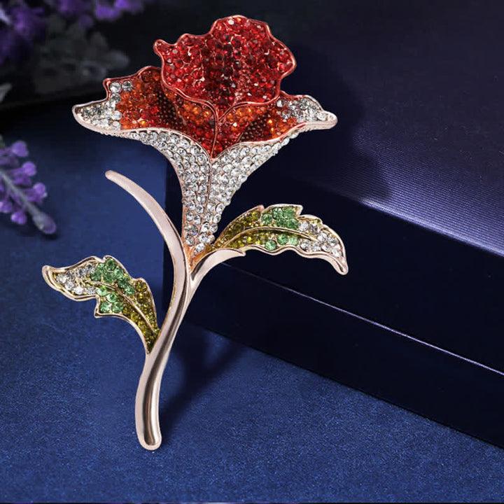 Graziosa spilla con fiore di orchidea e strass