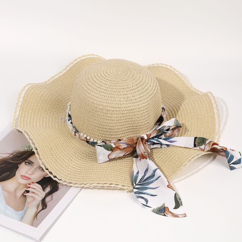 Cappello di paglia pieghevole con decorazione di perle e nastri floreali estivi da donna
