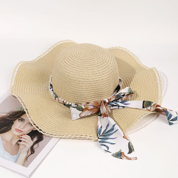 Cappello di paglia pieghevole con decorazione di perle e nastri floreali estivi da donna