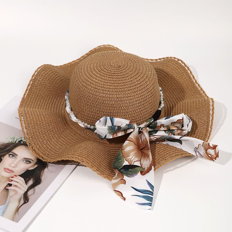 Cappello di paglia pieghevole con decorazione di perle e nastri floreali estivi da donna