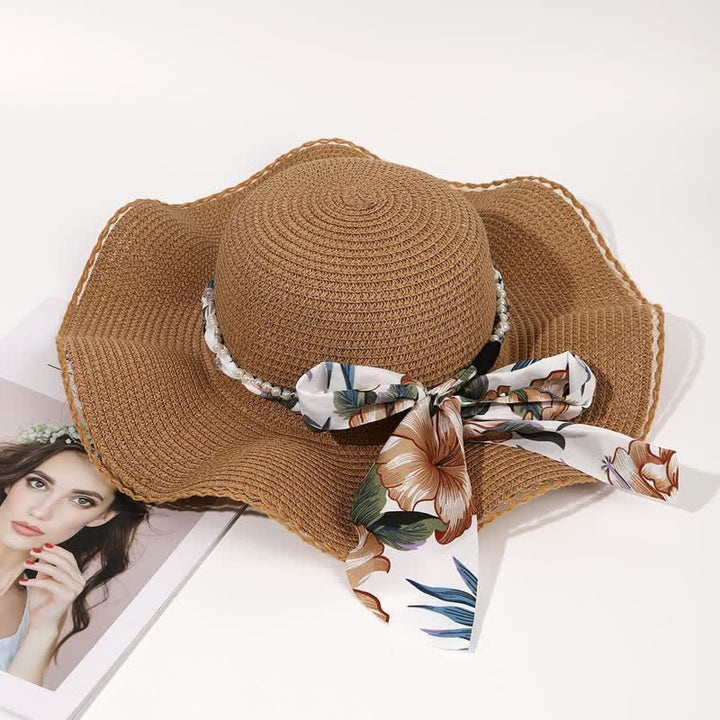 Cappello di paglia pieghevole con decorazione di perle e nastri floreali estivi da donna