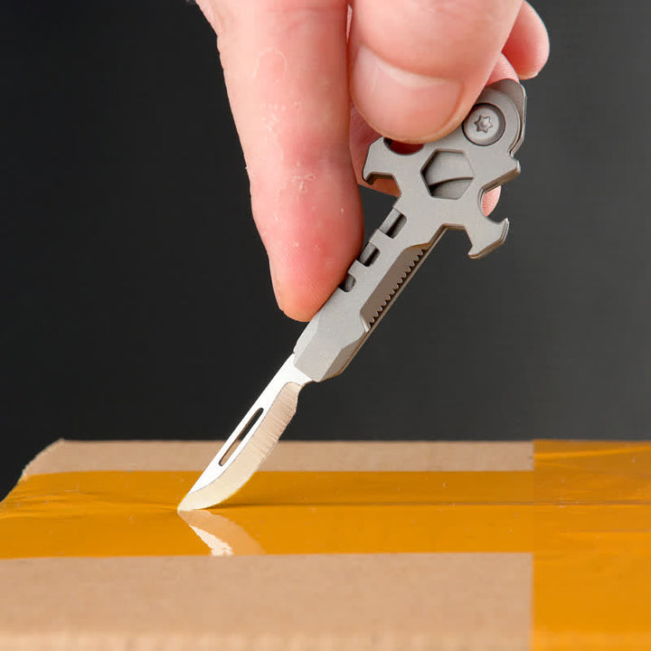 Portachiavi con mini coltello pieghevole multifunzionale in titanio Cross