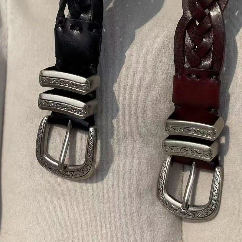 Cintura in pelle con fibbia argentata intagliata e intrecciata alla moda