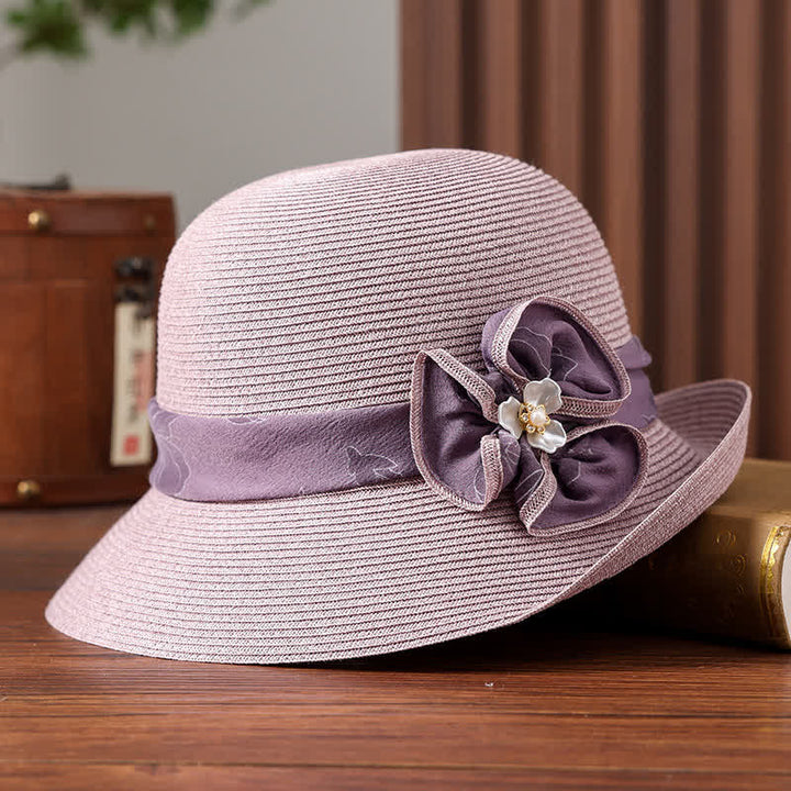 Cappello da donna in paglia con decorazione a margherita e nastro floreale