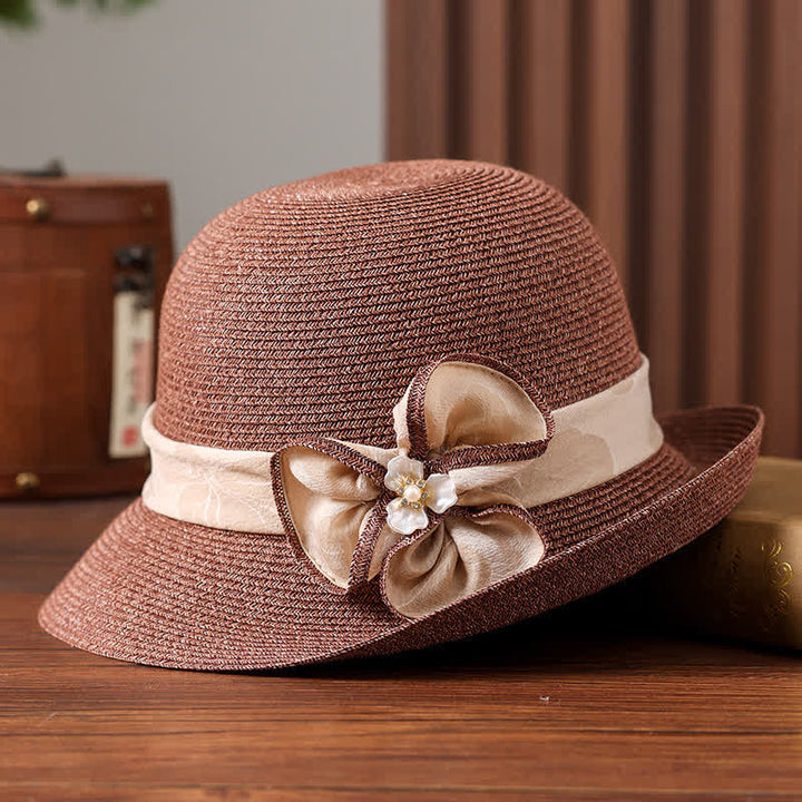 Cappello da donna in paglia con decorazione a margherita e nastro floreale