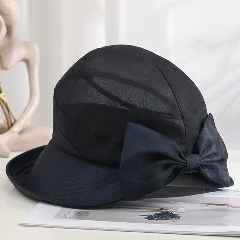 Cappello da sole pieghevole in seta con tesa larga e nodo a fiocco grande da donna
