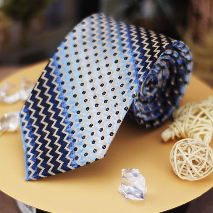Cravatta a righe a zig-zag con pois blu e neri sfumati da uomo