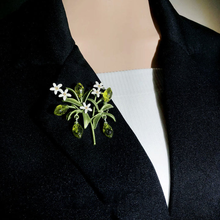 Spilla da donna a forma di goccia di limone con pianta verde