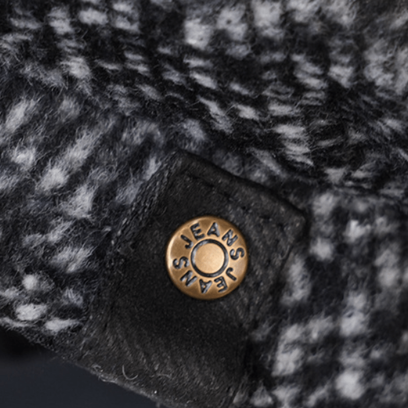 Berretto ottagonale da strillone in tweed maculato nero