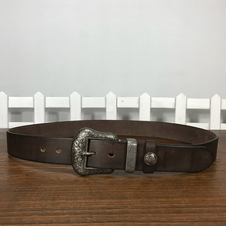 Cintura in pelle con elemento floreale indiano inciso