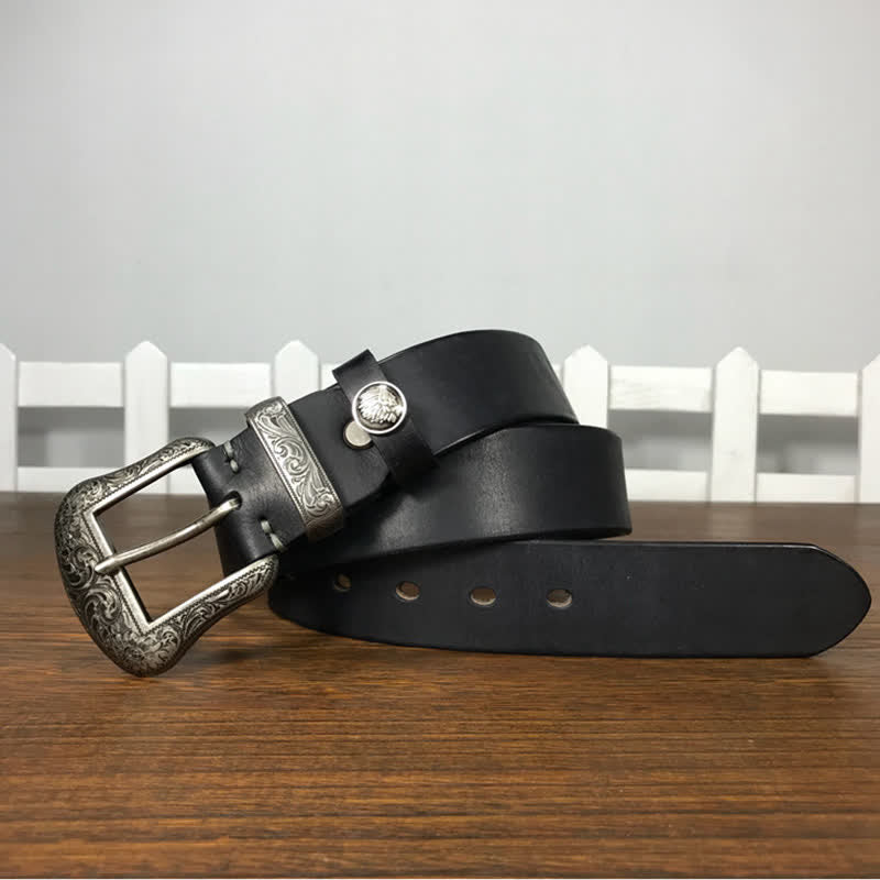 Cintura in pelle con elemento floreale indiano inciso