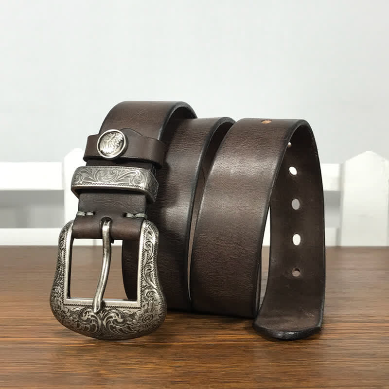 Cintura in pelle con elemento floreale indiano inciso