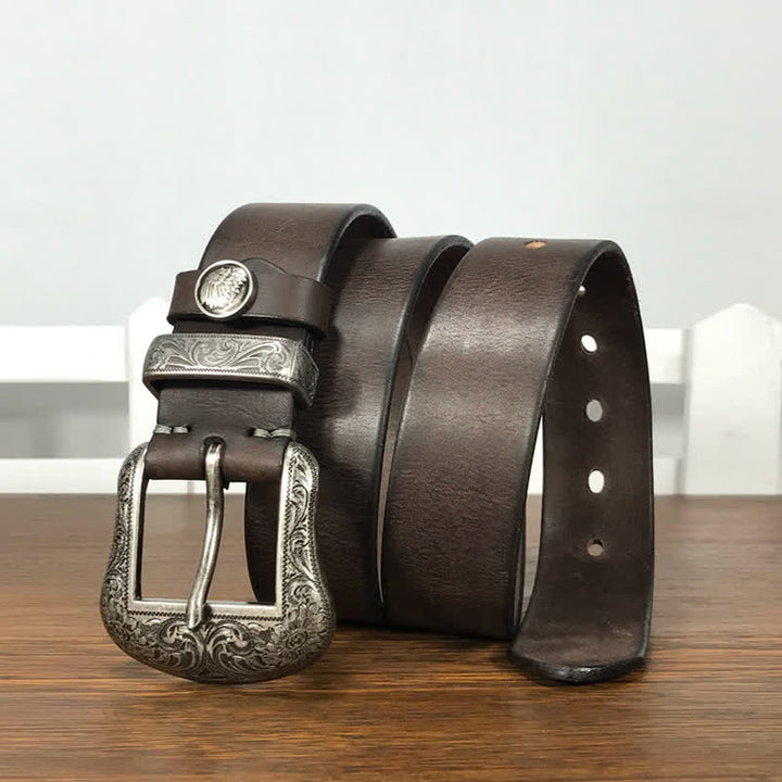 Cintura in pelle con elemento floreale indiano inciso