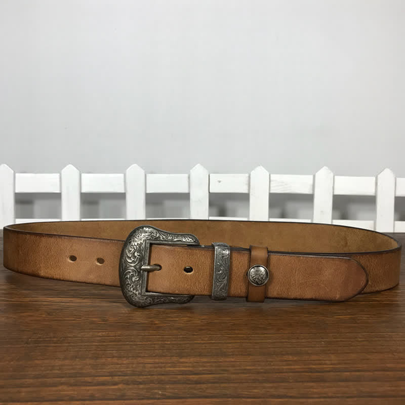 Cintura in pelle con elemento floreale indiano inciso
