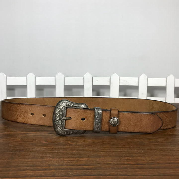 Cintura in pelle con elemento floreale indiano inciso