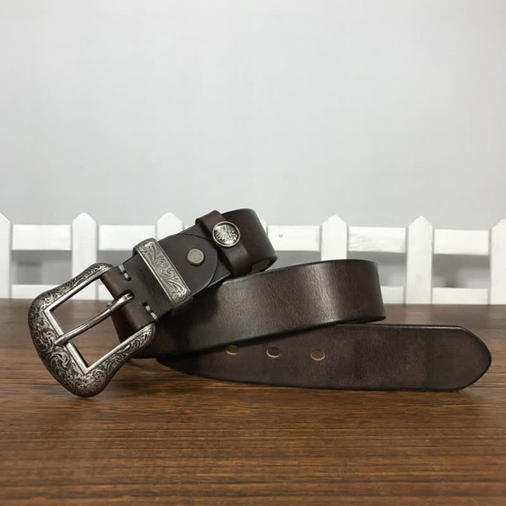 Cintura in pelle con elemento floreale indiano inciso