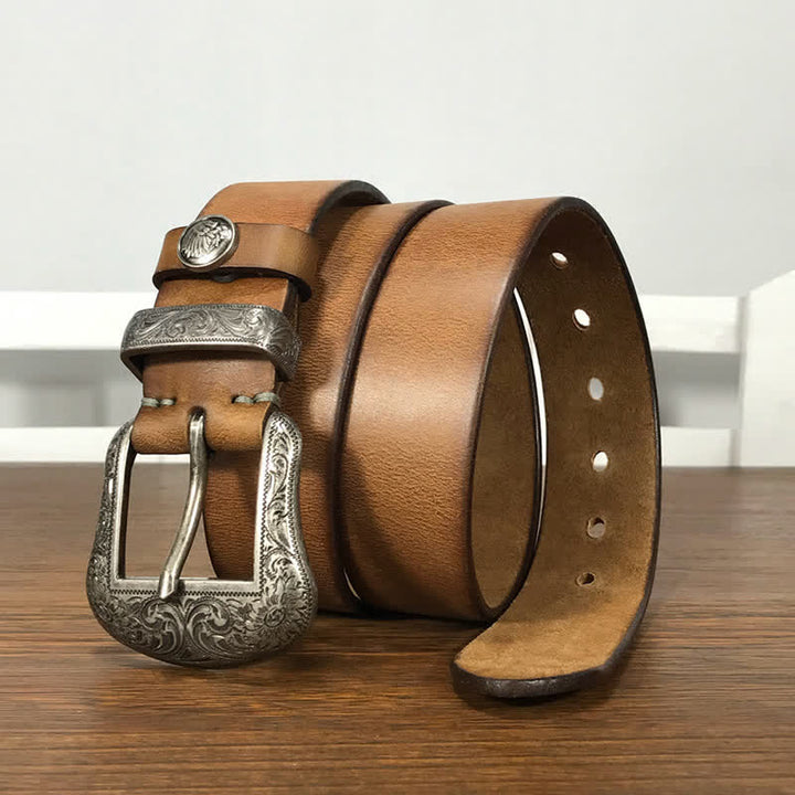 Cintura in pelle con elemento floreale indiano inciso