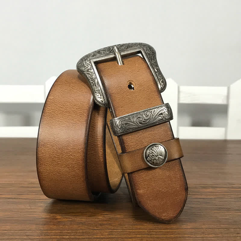 Cintura in pelle con elemento floreale indiano inciso