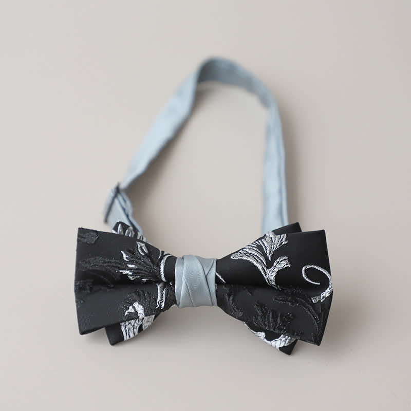Papillon da uomo con ricamo floreale bianco e nero