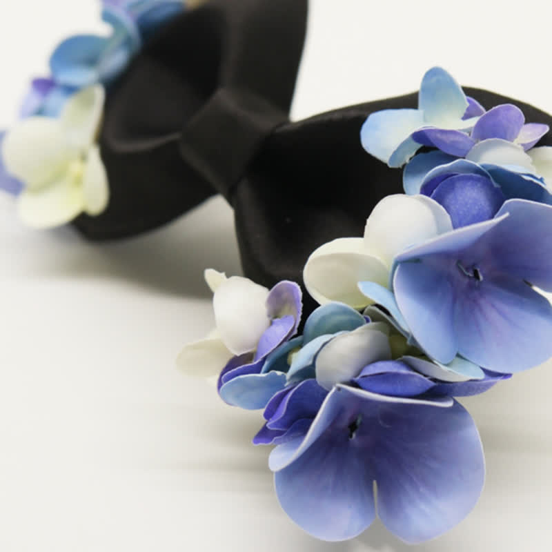 Papillon da uomo con fiori artificiali viola e bianchi da giardino