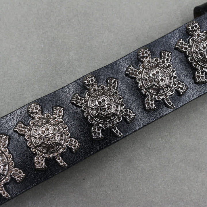 Cintura in pelle con doppio perno e rivetti a tartaruga in metallo tridimensionale