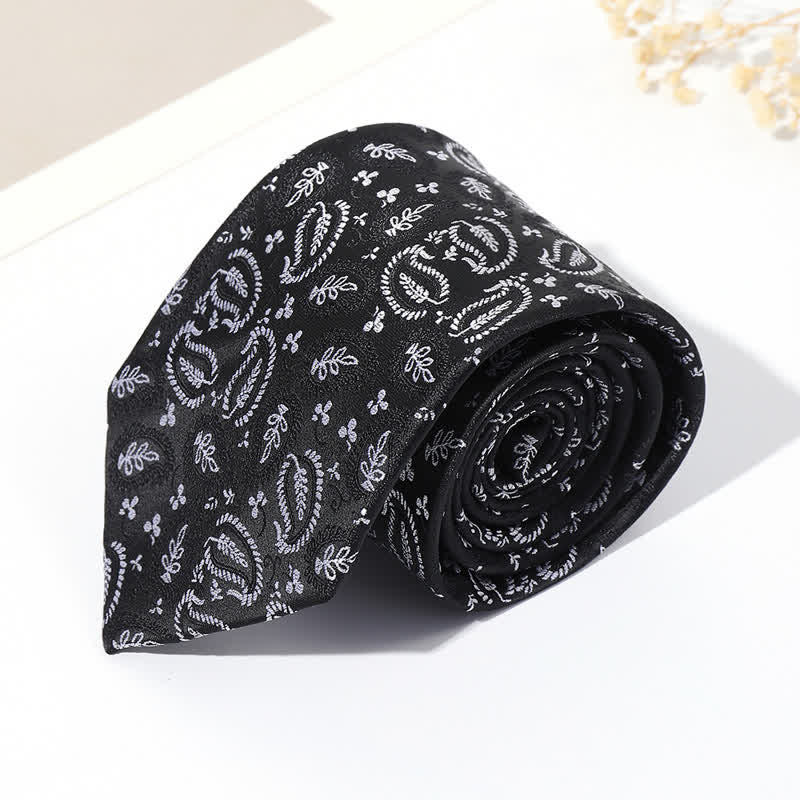 Cravatta da uomo in jacquard con sfondo nero e motivo anacardi