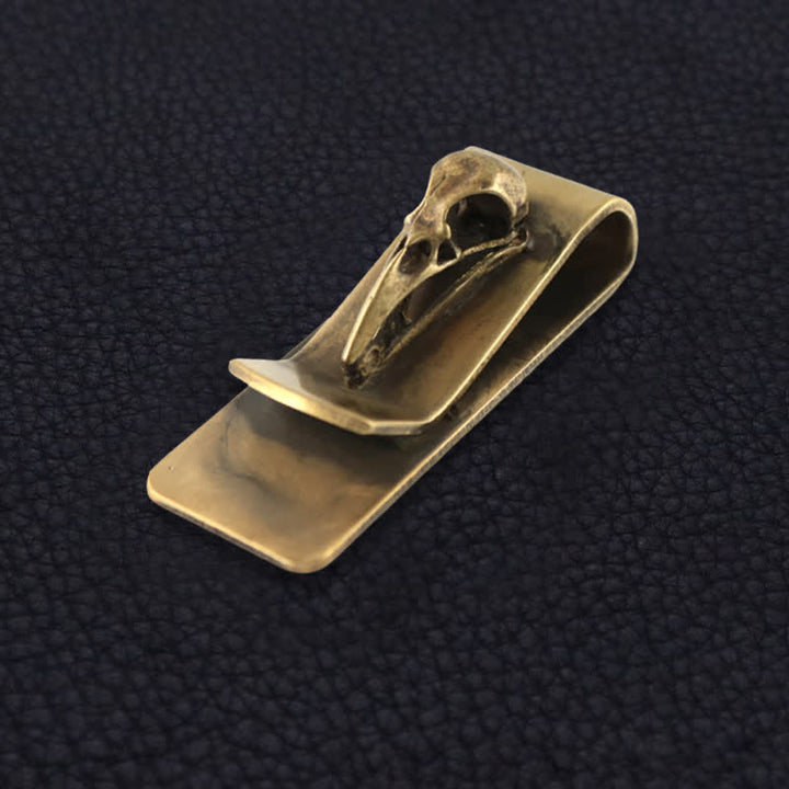 Fermasoldi portatile creativo in ottone a forma di teschio di uccello