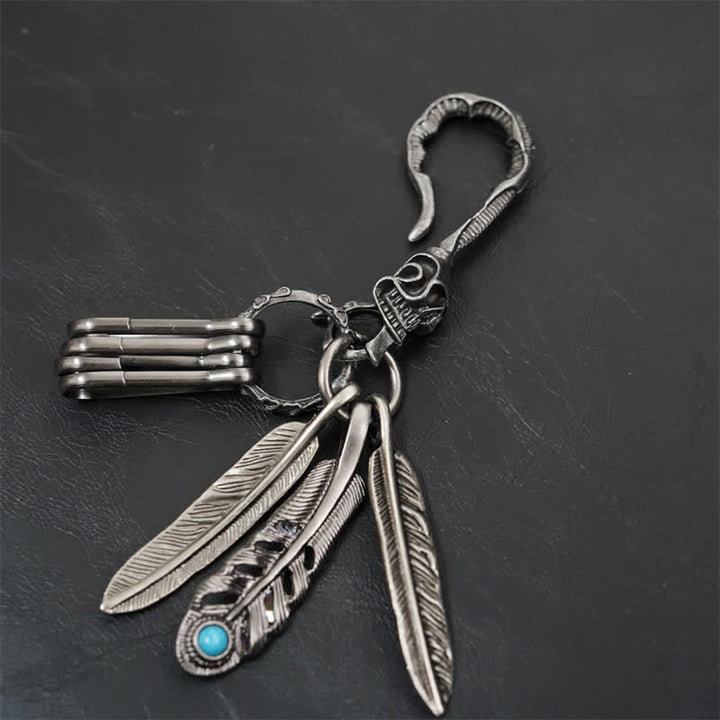 Portachiavi in pelle turchese blu con piume di teschio boho