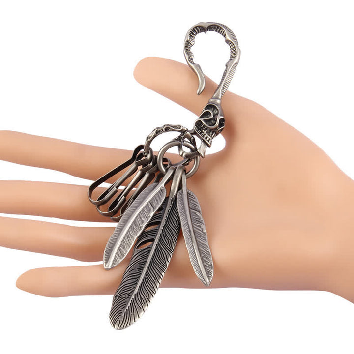 Portachiavi in pelle turchese blu con piume di teschio boho