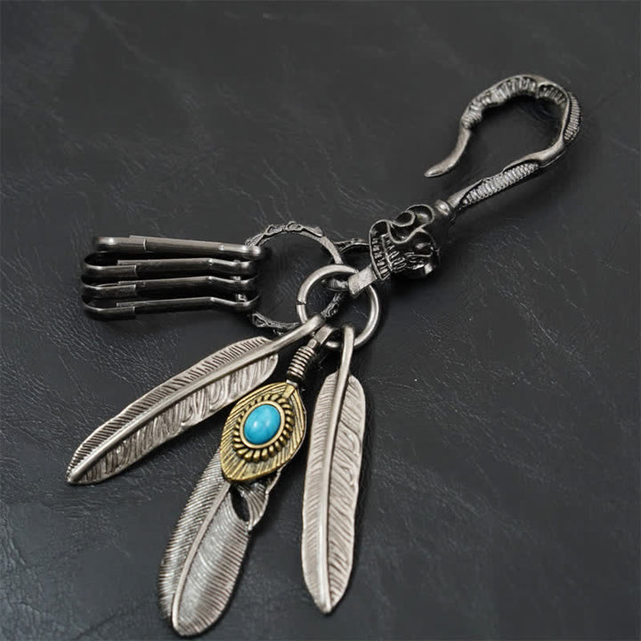 Portachiavi in pelle turchese blu con piume di teschio boho