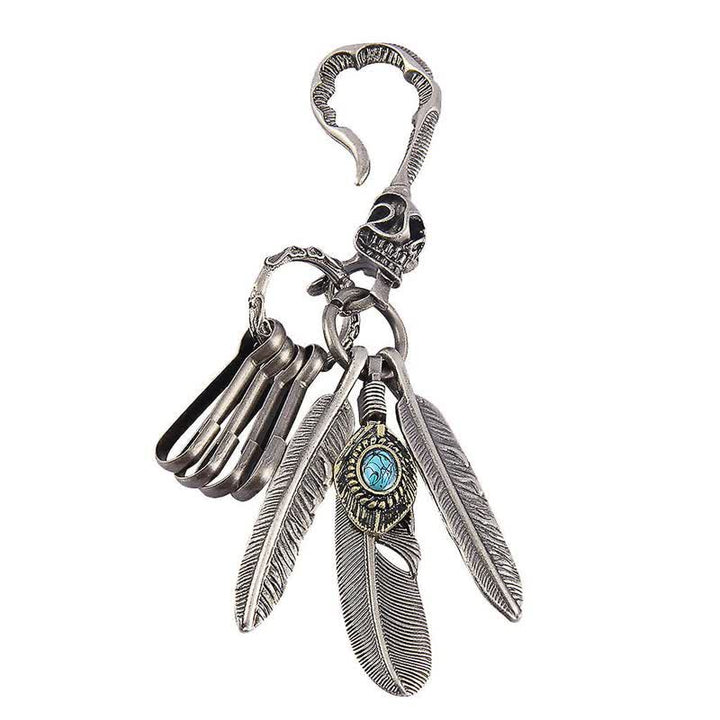 Portachiavi in pelle turchese blu con piume di teschio boho