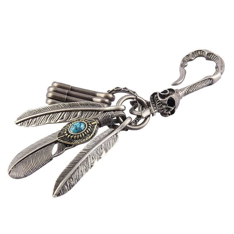 Portachiavi in pelle turchese blu con piume di teschio boho