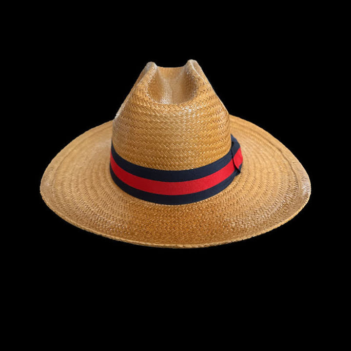 Cappello da cowboy in paglia intrecciata con nastro rosso e blu navy decorativo