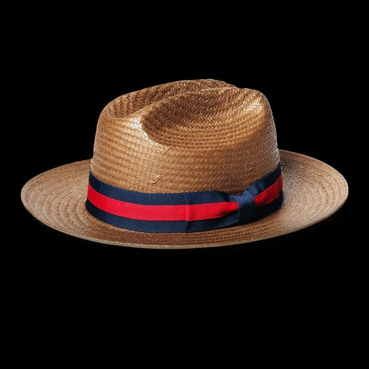 Cappello da cowboy in paglia intrecciata con nastro rosso e blu navy decorativo