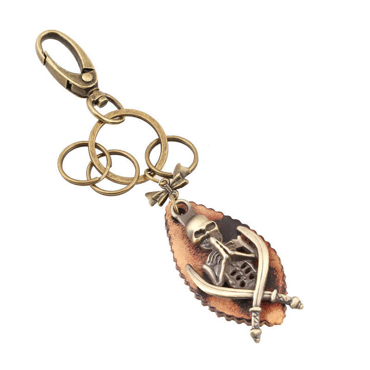 Portachiavi in pelle placcata in bronzo con scheletro punk