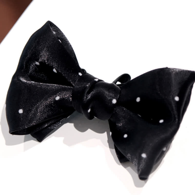 Papillon romantico a pois bianchi e neri da uomo