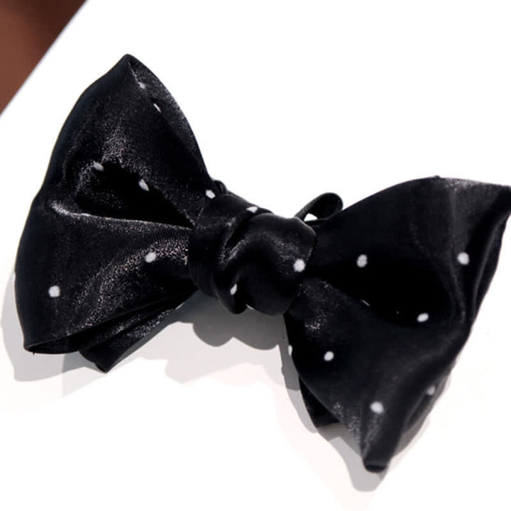 Papillon romantico a pois bianchi e neri da uomo