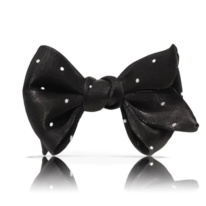 Papillon romantico a pois bianchi e neri da uomo