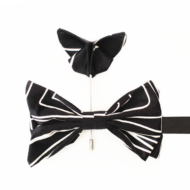 Papillon da uomo con linee geometriche bianche e nere
