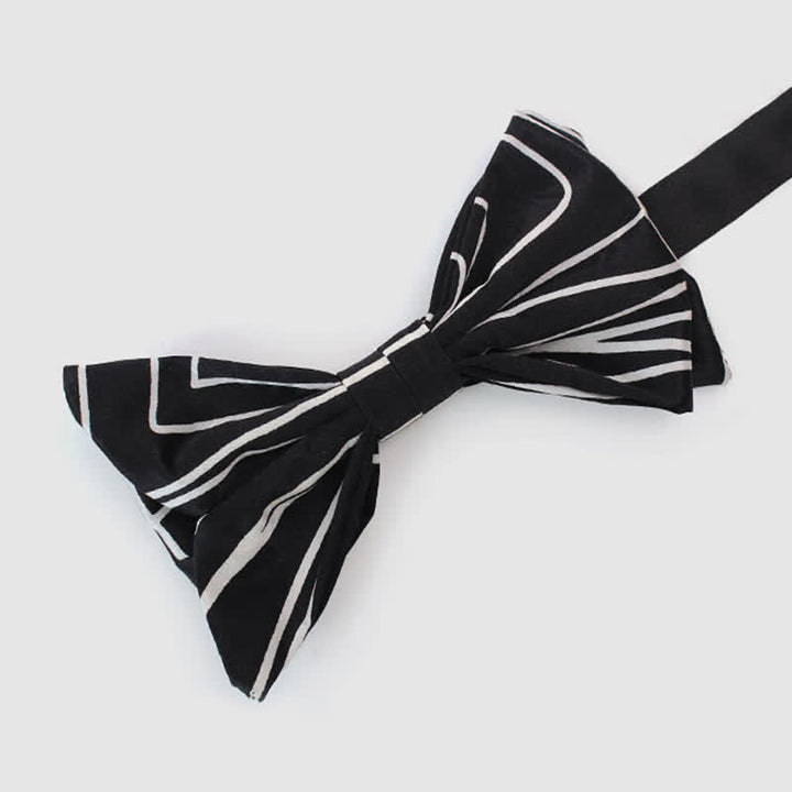 Papillon da uomo con linee geometriche bianche e nere