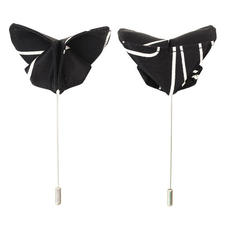 Papillon da uomo con linee geometriche bianche e nere
