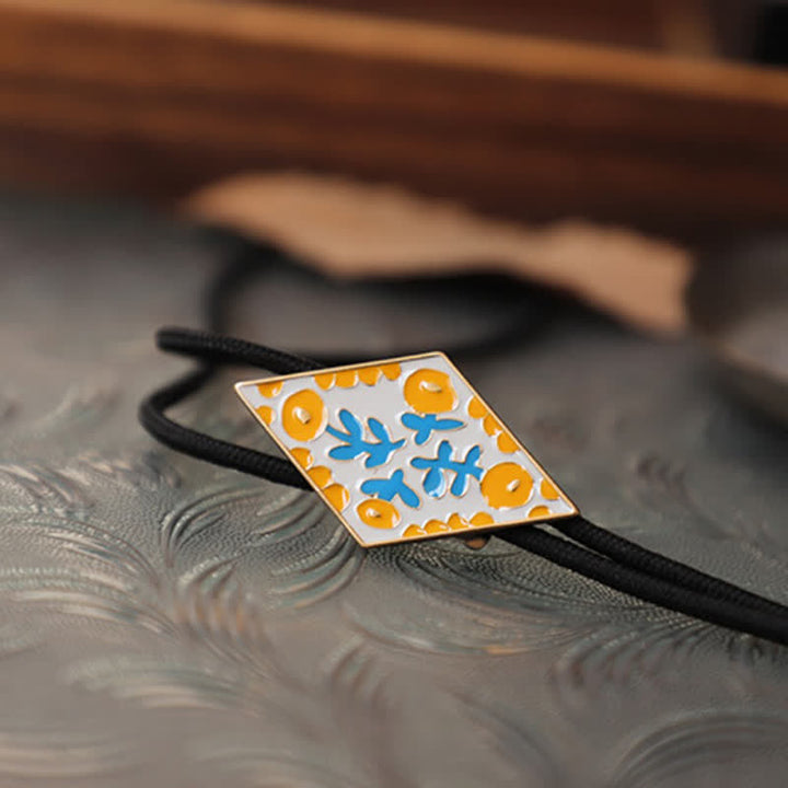 Cravatta Bolo con piccolo fiore colorato e rombo retrò