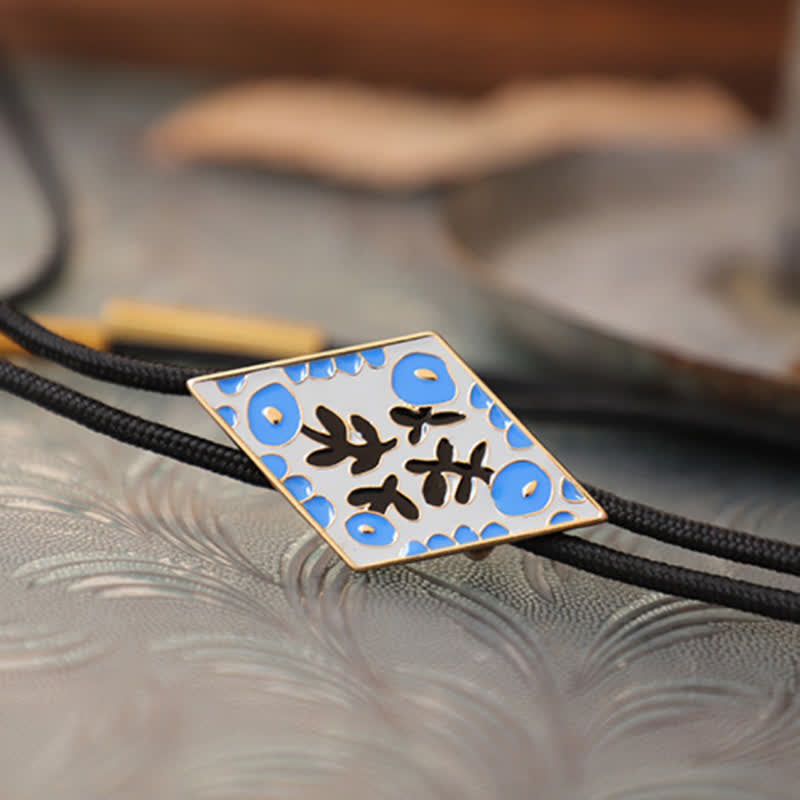 Cravatta Bolo con piccolo fiore colorato e rombo retrò