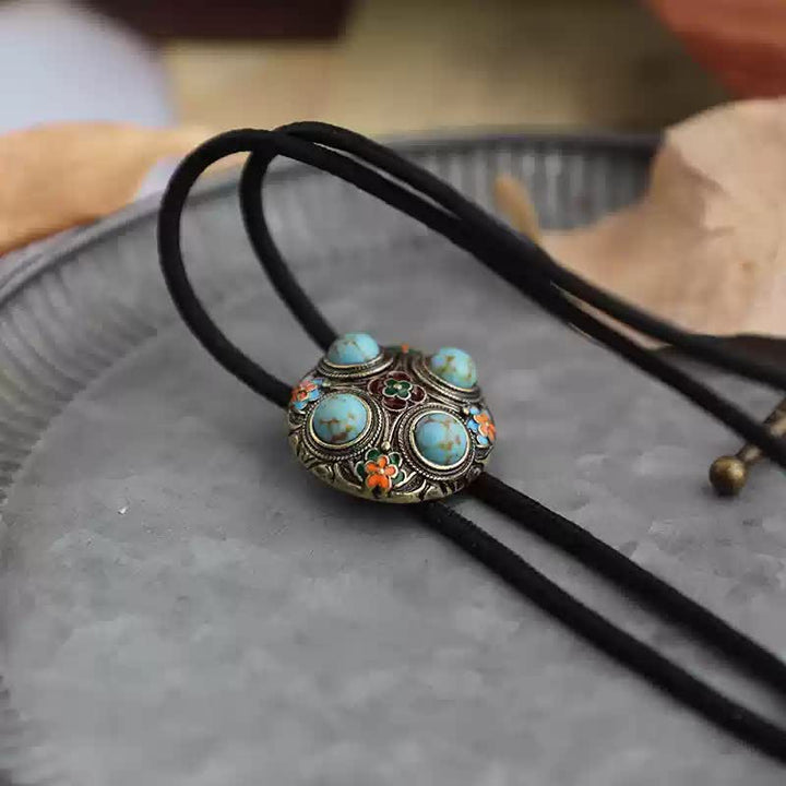 Cravatta Bolo con fiore in smalto turchese blu antico