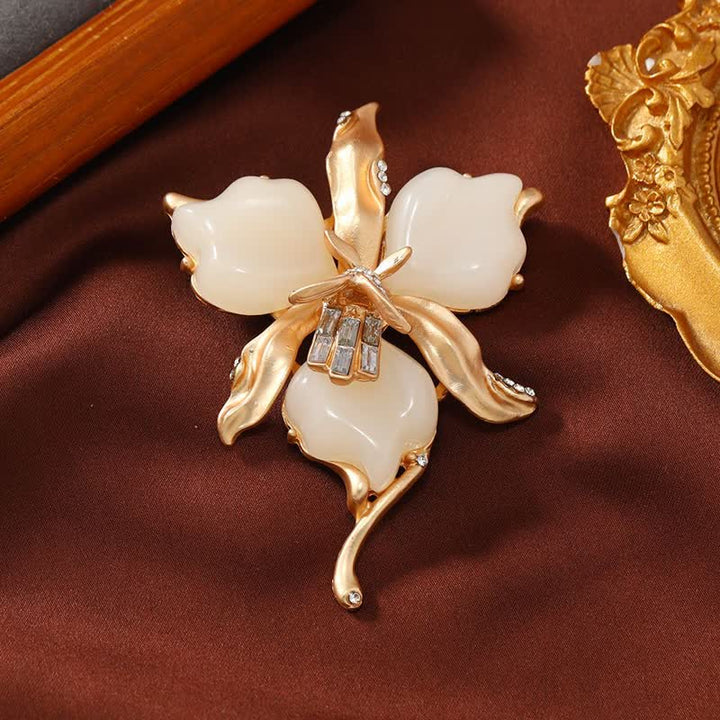 Spilla da donna in ottone metallizzato con fiore di orchidea in resina a forma di petalo
