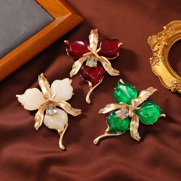 Spilla da donna in ottone metallizzato con fiore di orchidea in resina a forma di petalo