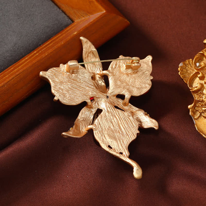 Spilla da donna in ottone metallizzato con fiore di orchidea in resina a forma di petalo